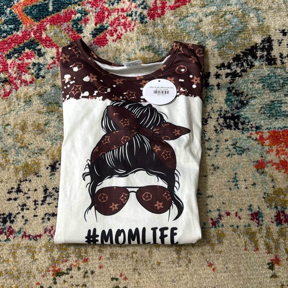 Brand new, with tags boutique brand T-shirt. Size small.